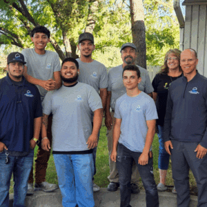 Certified flood cleanup team from Bio Clean of Utah with happy homeowners.