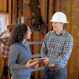 Restoration technician using moisture detection tools during ceiling water damage assessment